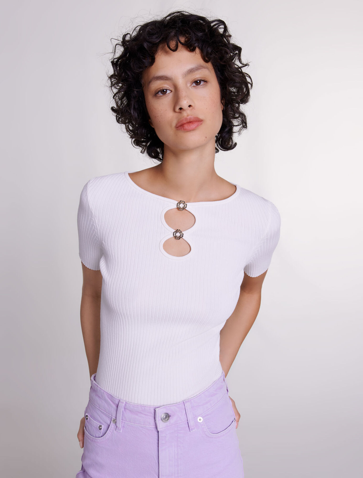 Cutaway knit top with jewellery