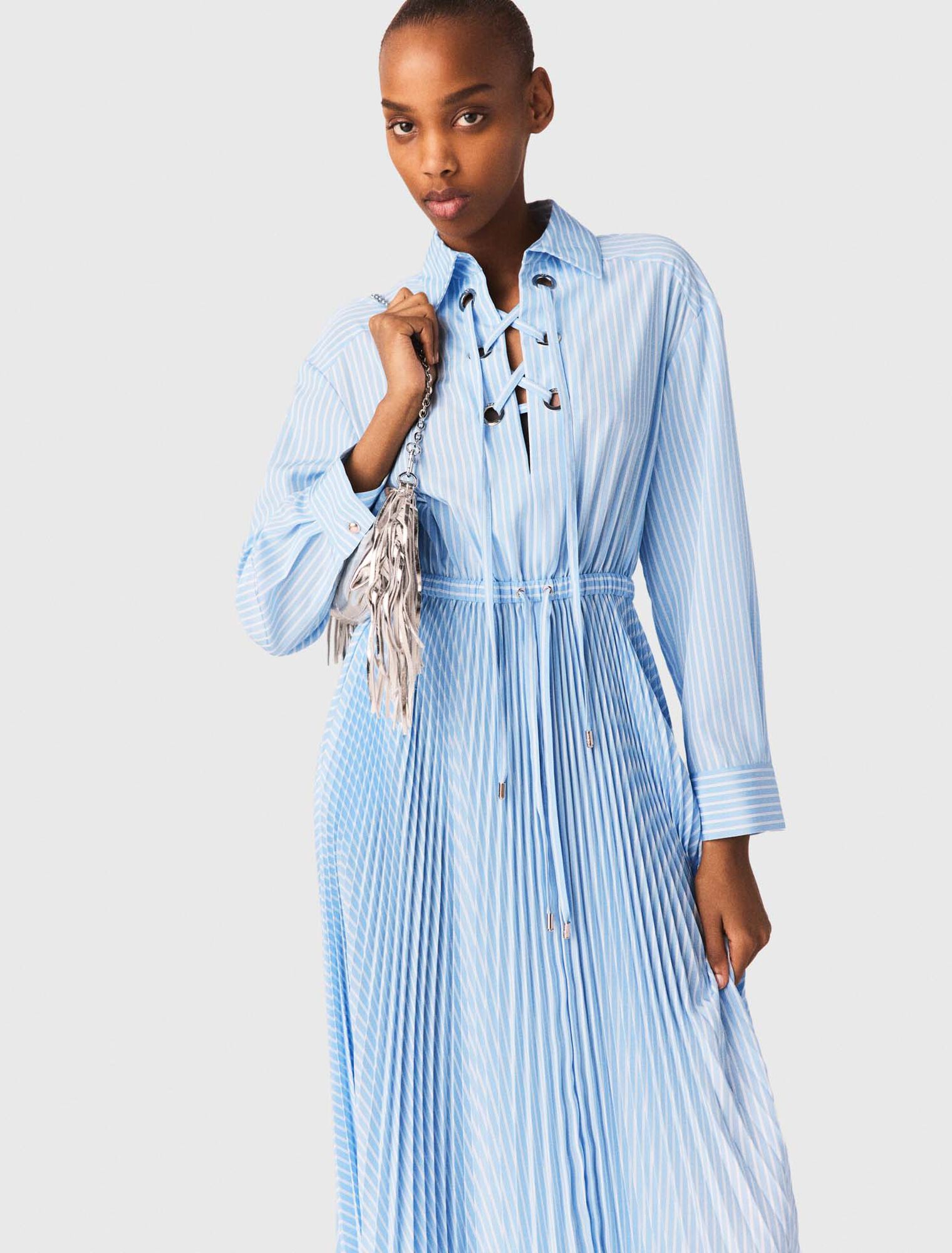 Long pleated dress with eyelets