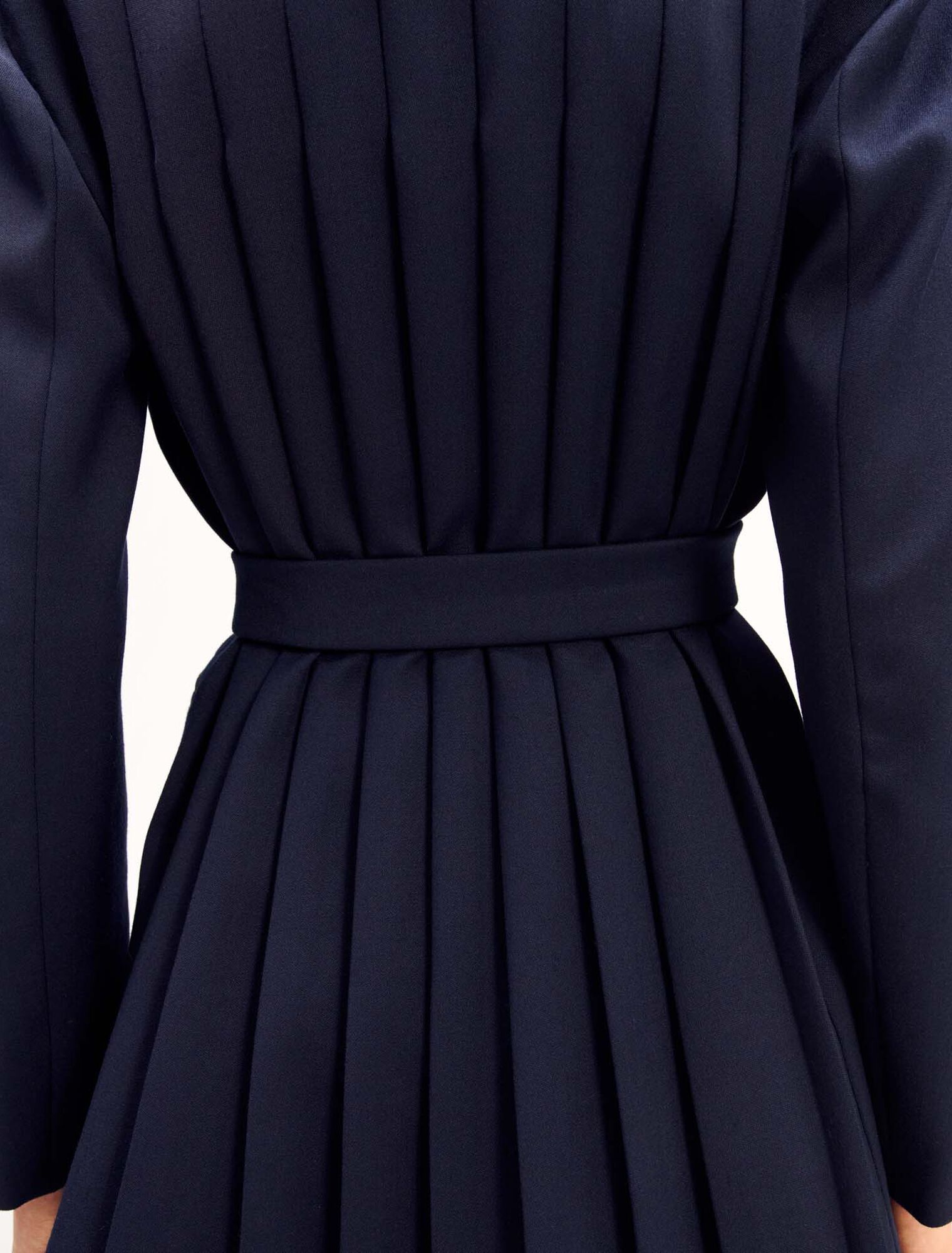 Suit jacket with pleated back