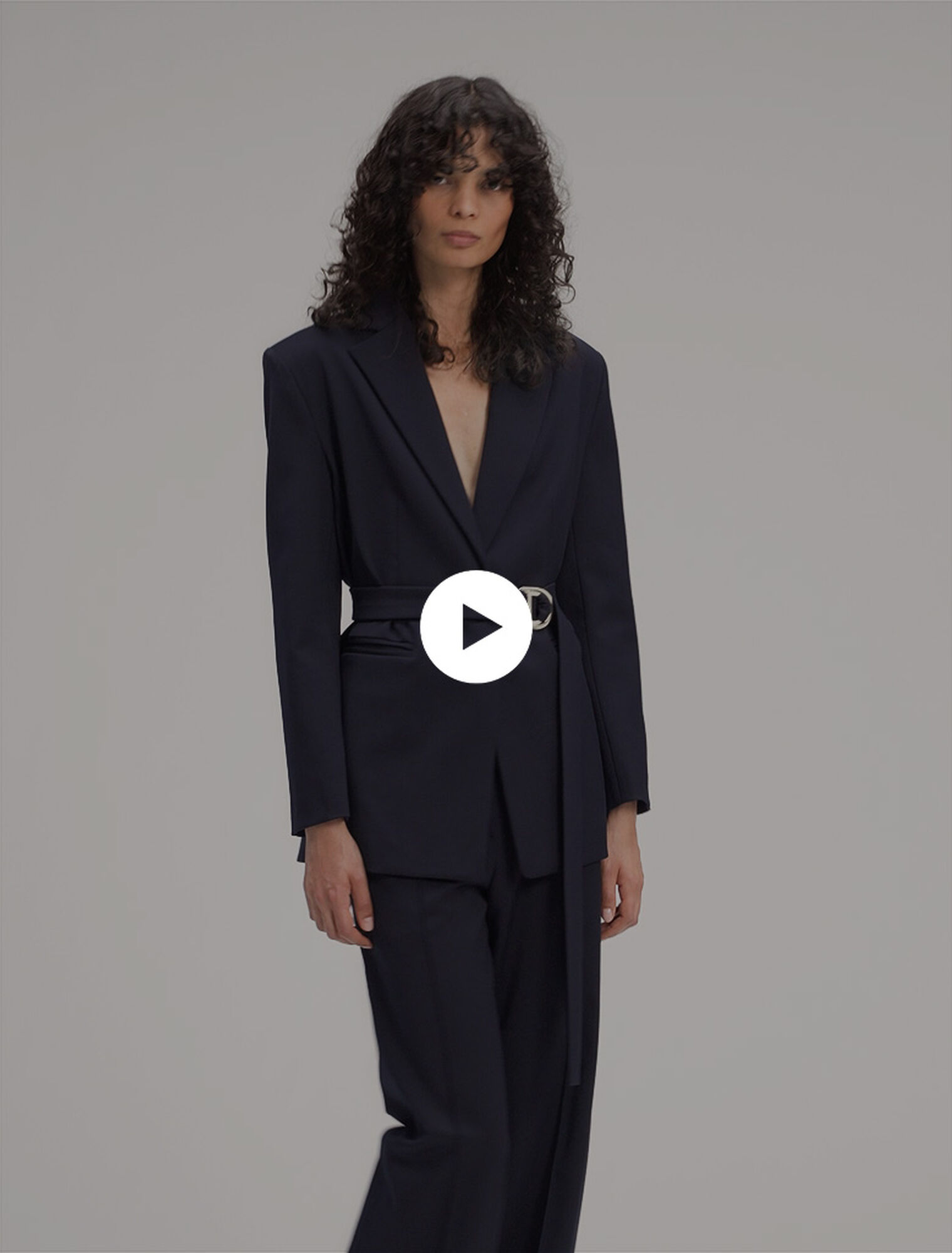 Suit jacket with pleated back