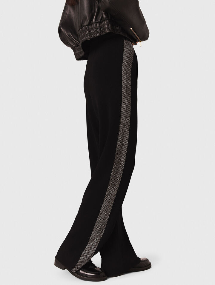 Trousers with rhinestone band