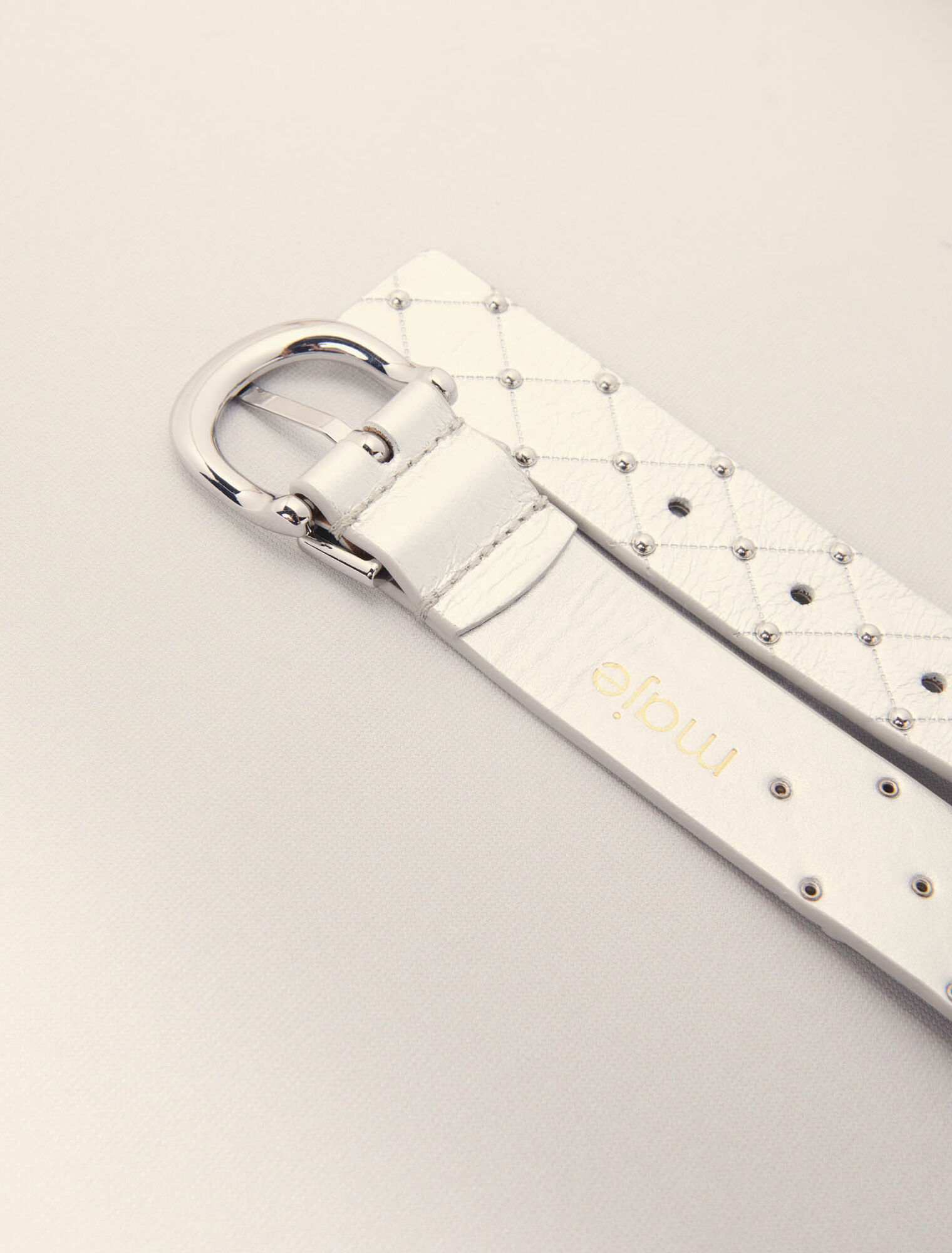 Quilted metallic leather belt