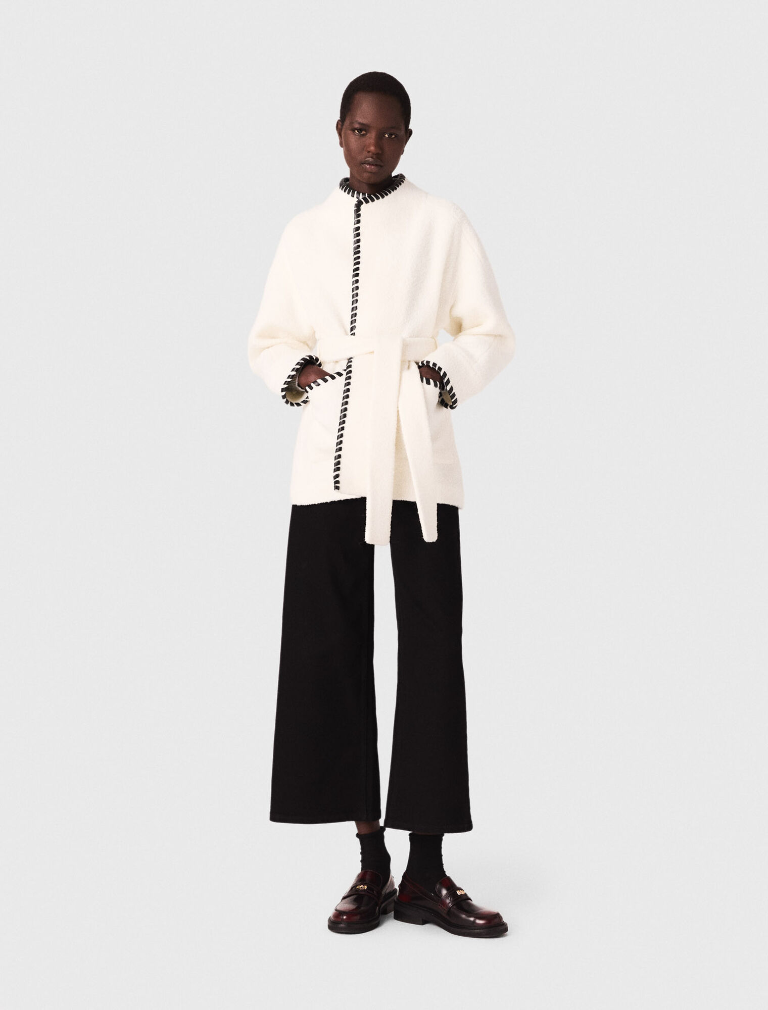 Lined coat with contrasting ribbon