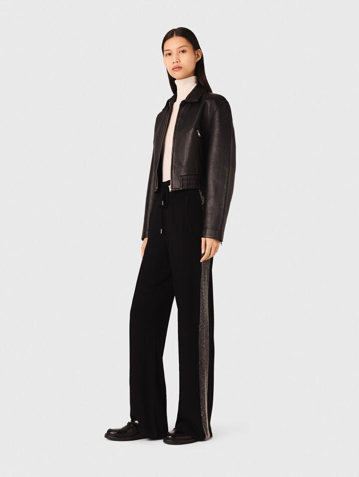 Trousers with rhinestone band