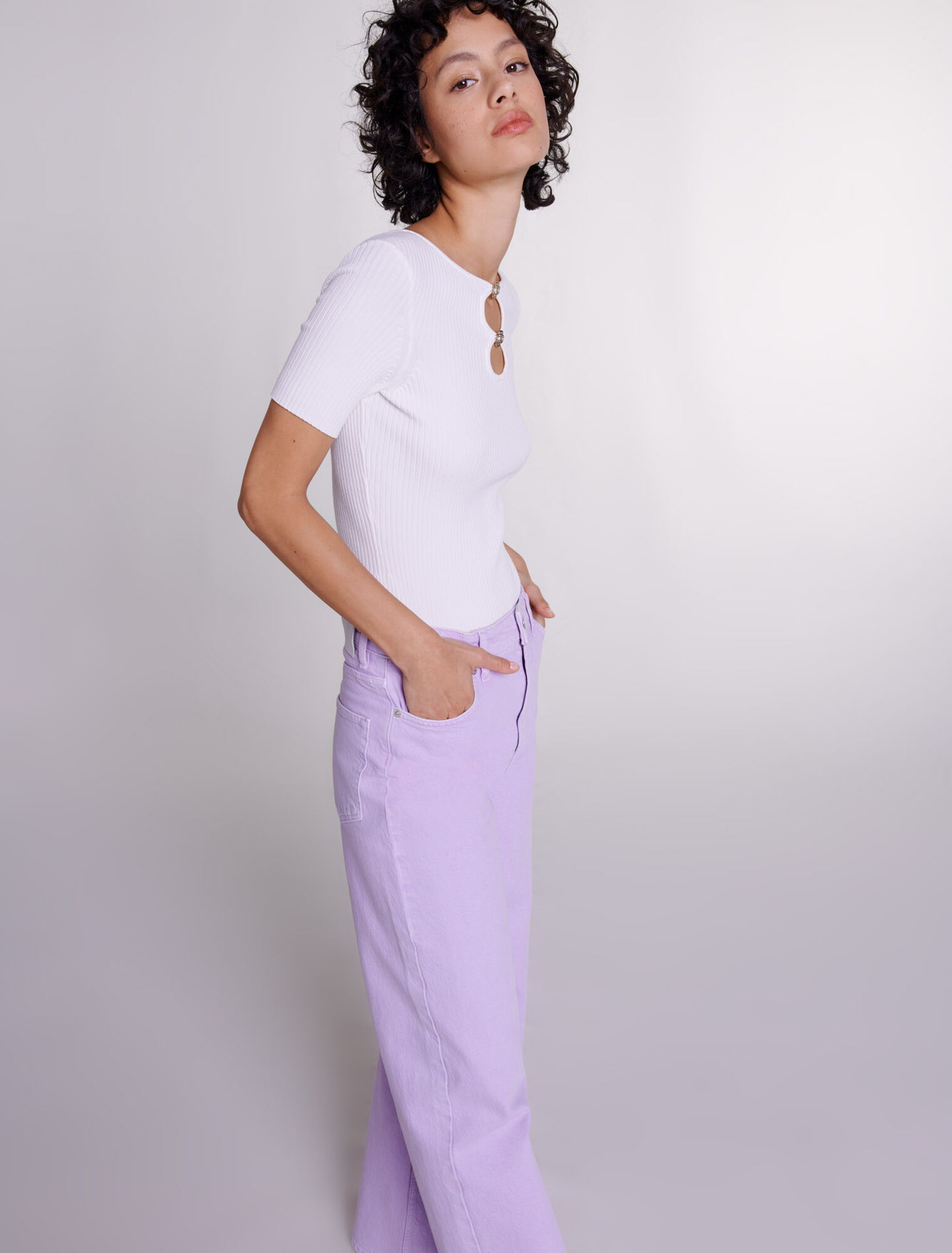 Cutaway knit top with jewellery