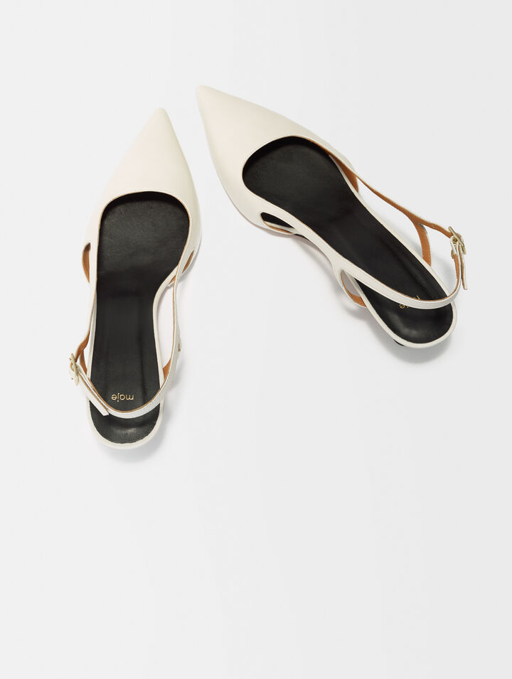 Pointed-toe pumps with straps