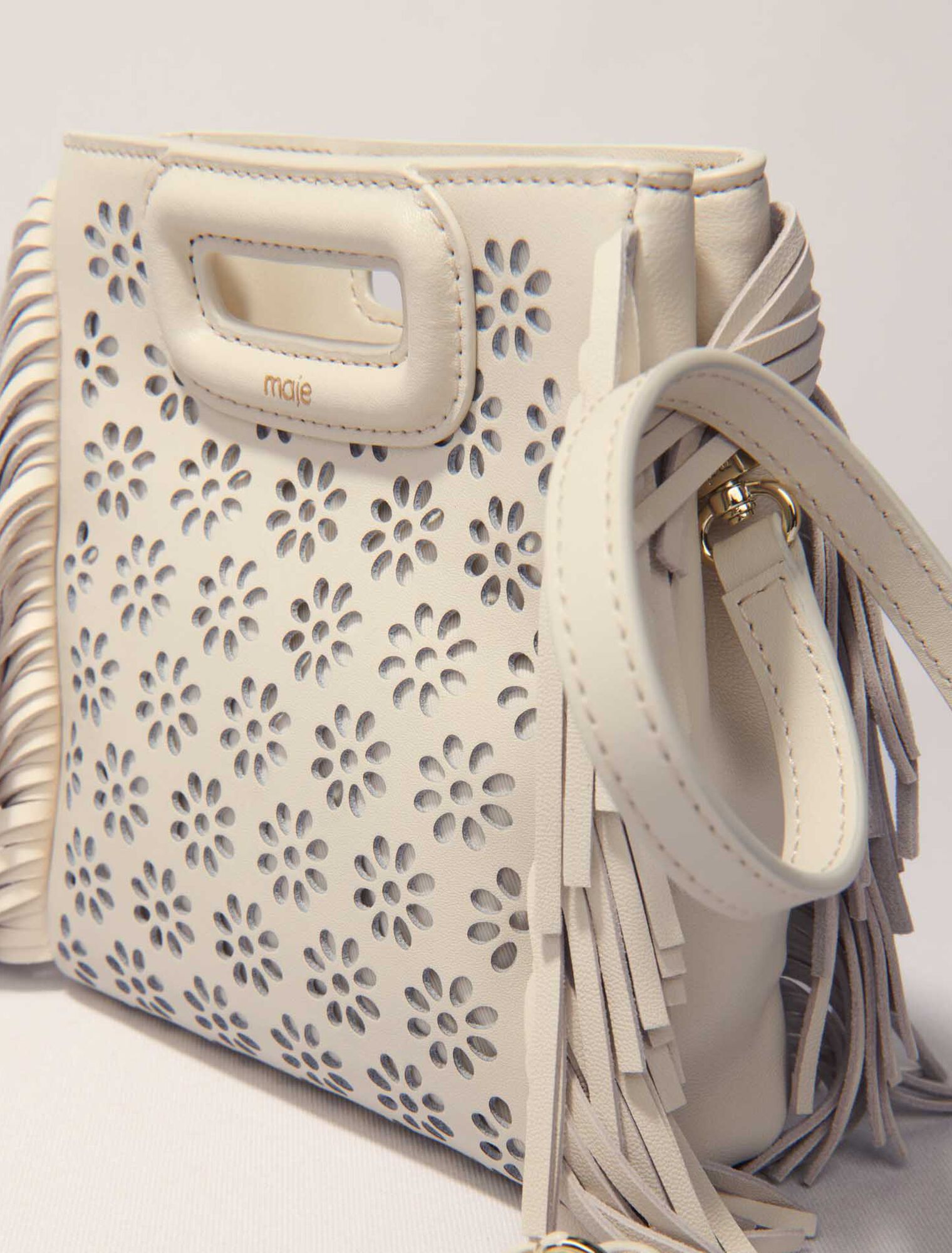 Perforated leather mini M bag