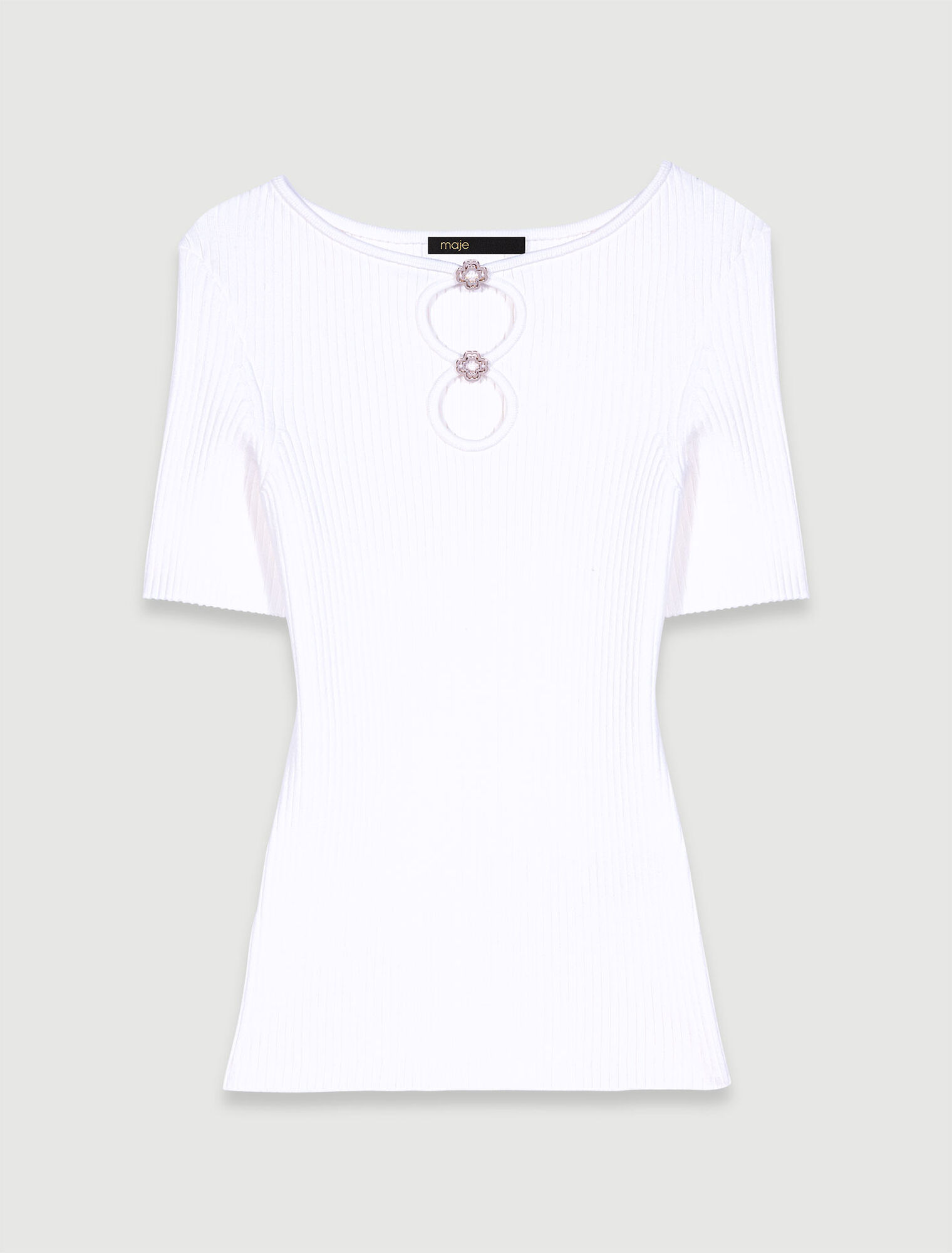 Cutaway knit top with jewellery