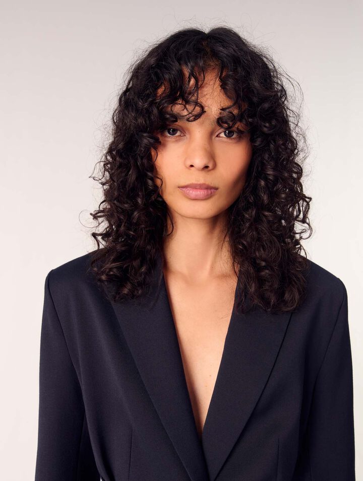 Suit jacket with pleated back