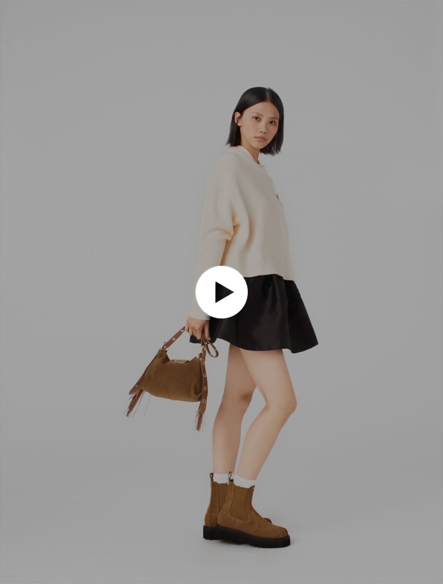 Jumper with floral brooch