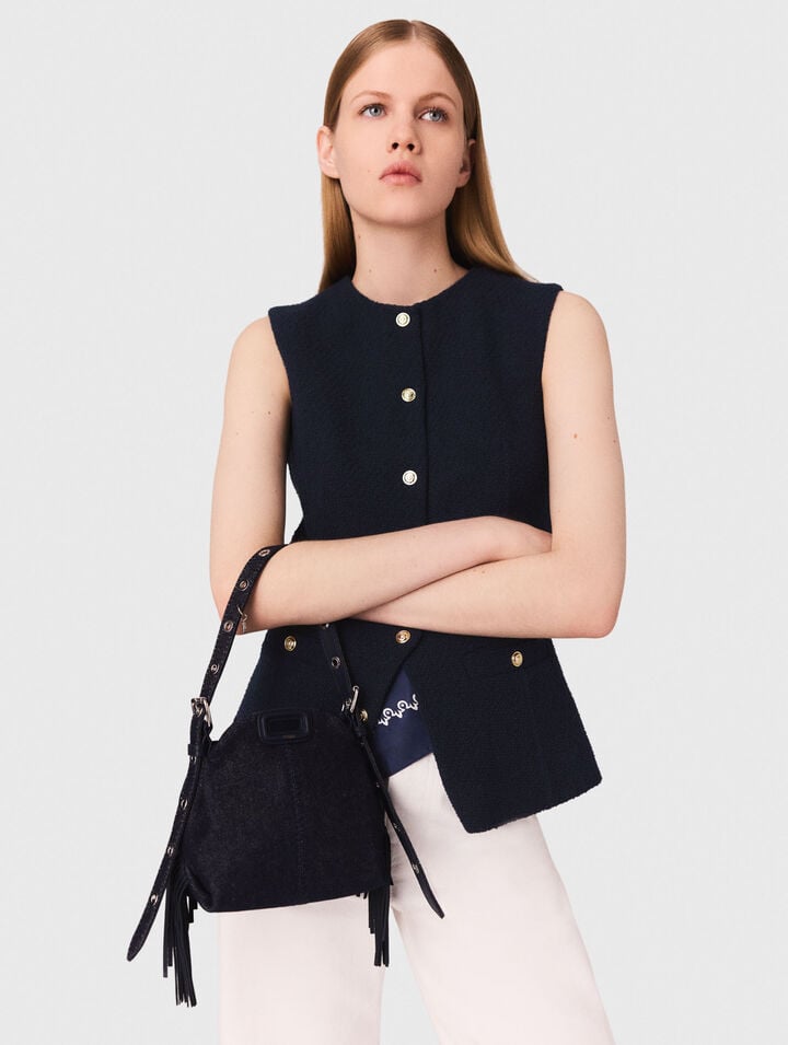 Long sleeveless tweed jacket