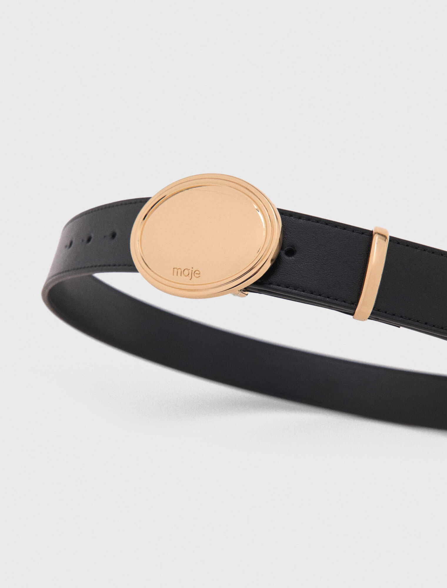 Leather belt with oval buckle